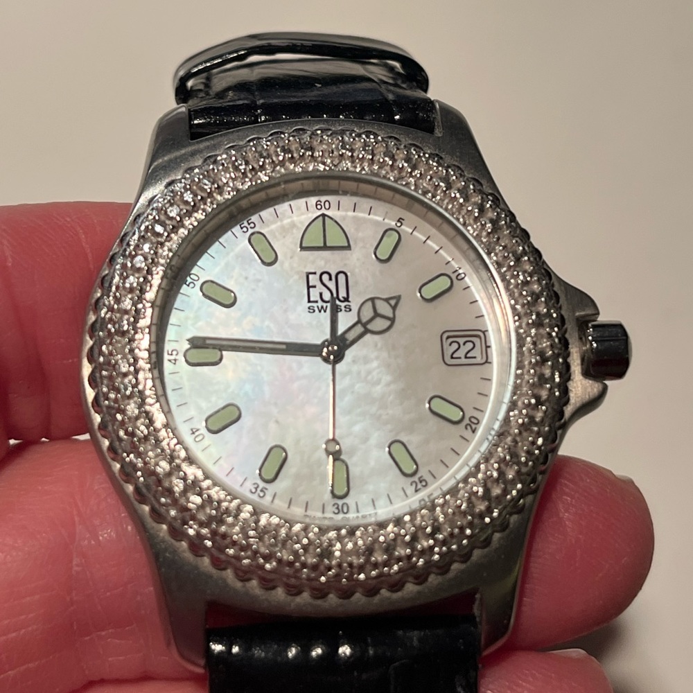 Gorgeous movado ESQ Swiss quartz watch. Mother of pearl face with diamond bezel.